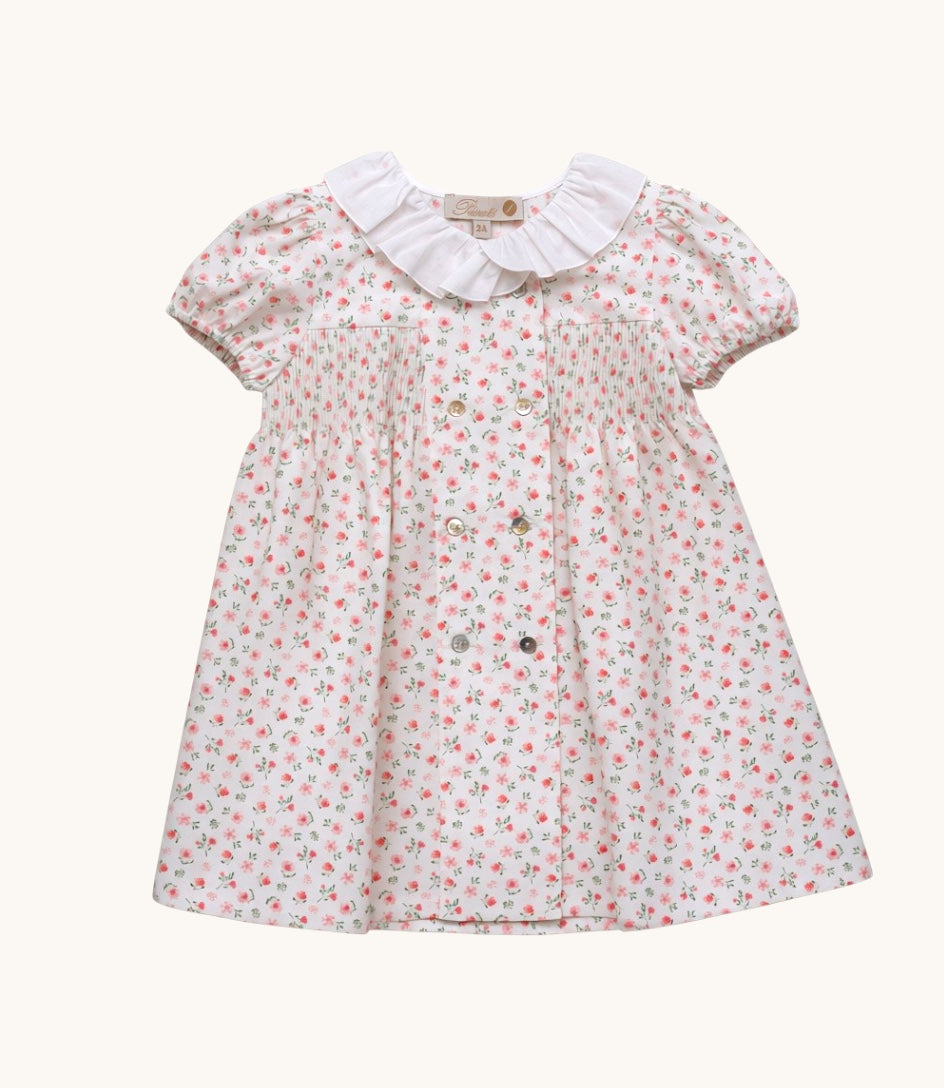 Vestido Ivoire Broderie de Magic Place Kids con estampado floral, cuello con volantes y detalle de nido de abeja.